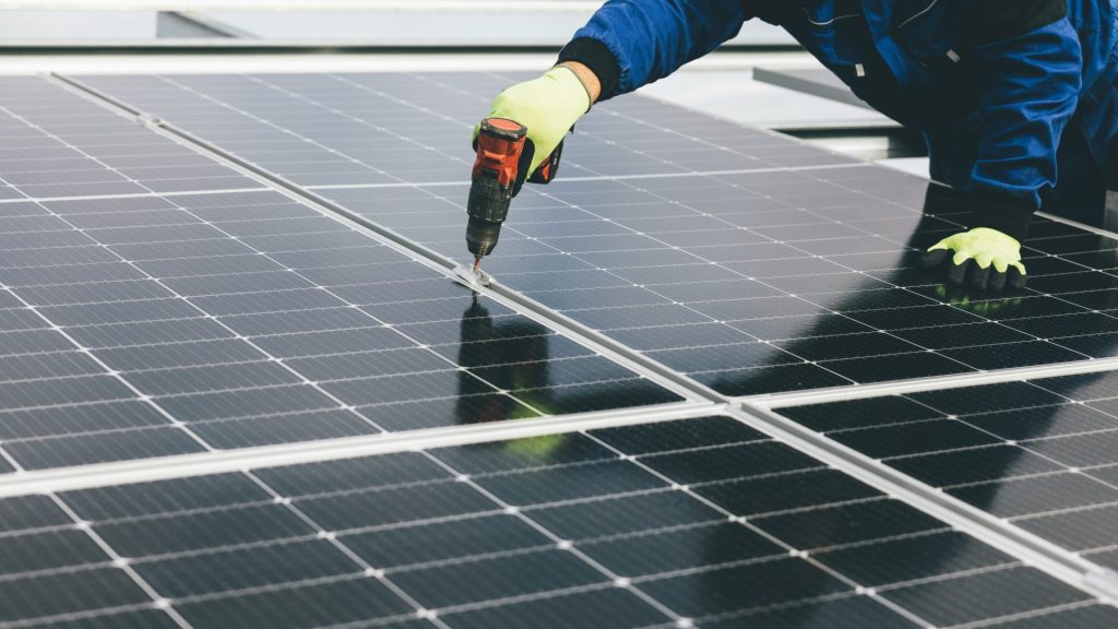 a person working on a solar panel